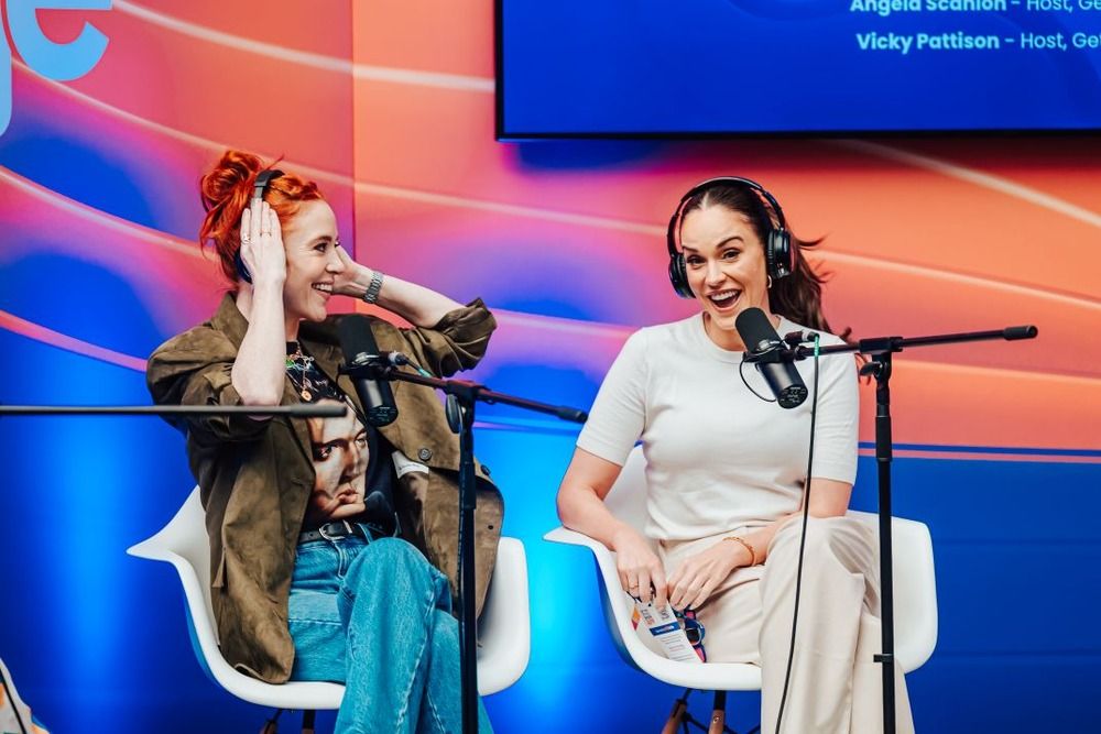 Image of Vikkie Pattinson and Angela Scanlon speaking on stage laughing.