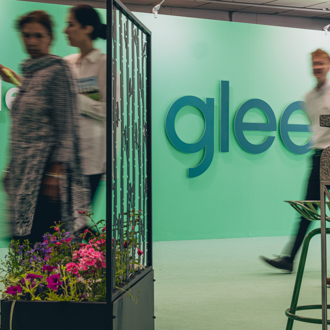 Glee visitors walking past entrance show sign