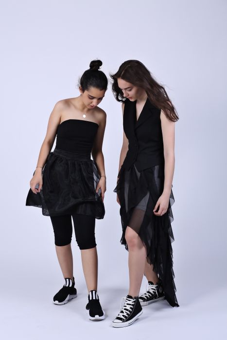 Black asymmetrical mesh skirt with vertical ruffles