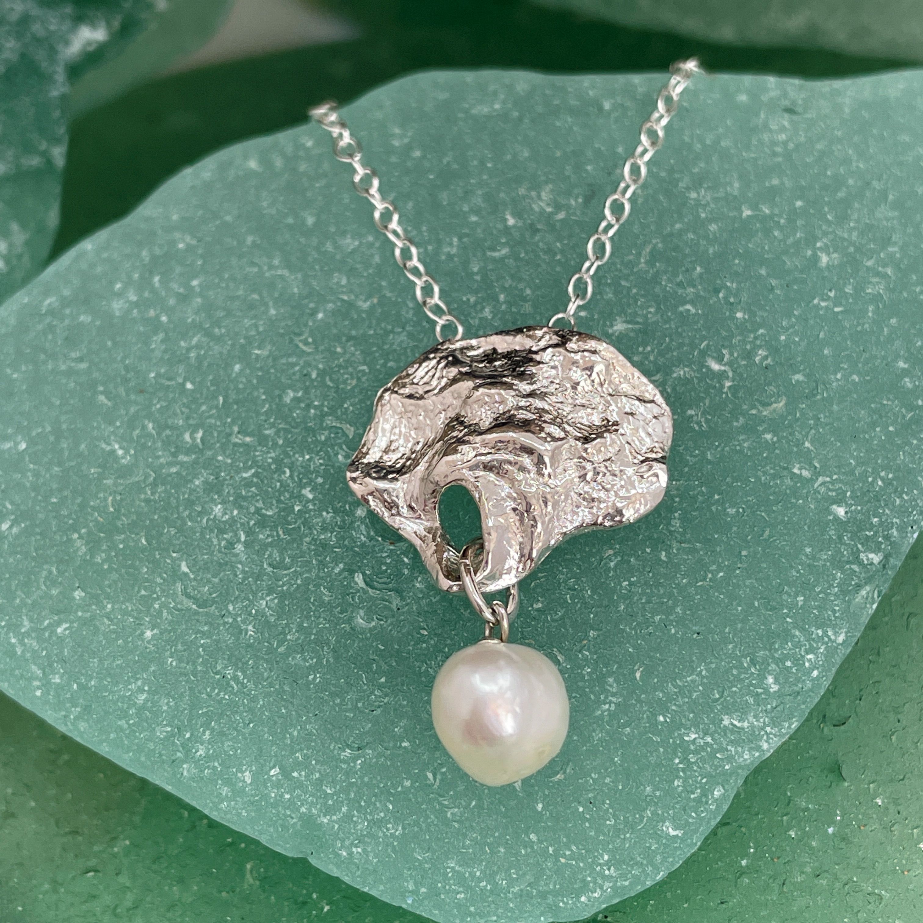 Silver oyster shell and pearl necklace