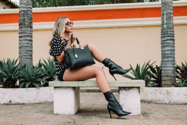 Girl wearing polka dot dress and leather boots