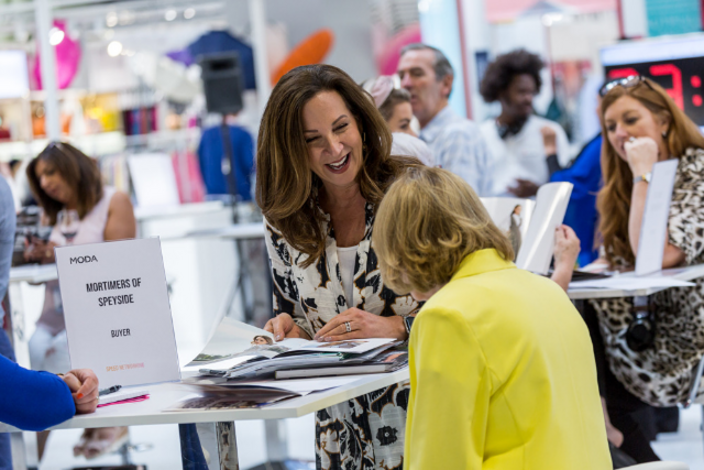 People networking at a trade show