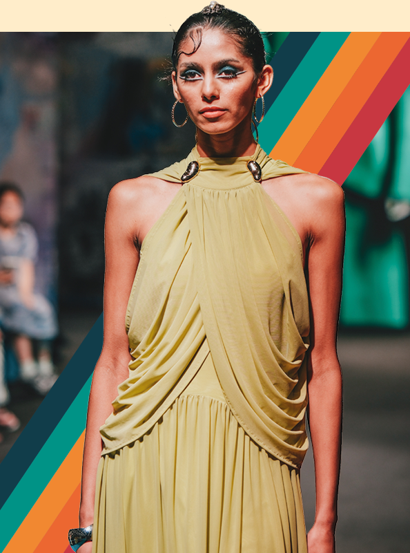 Model wearing a yellow dress on the Source Fashion catwalk