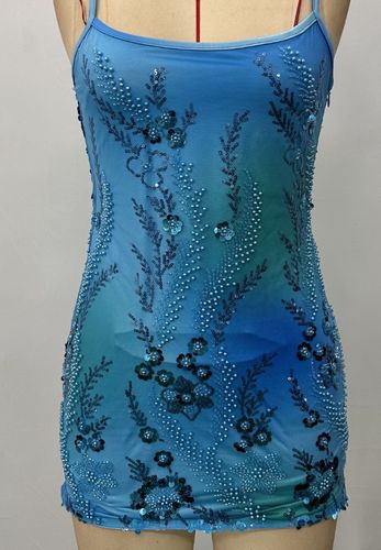 Featuring contrasting bead and sequin embellishment fabric