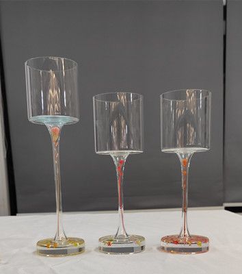 Glass candle holder with flower inside