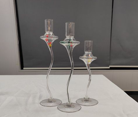 Glass candle holder with flower inside