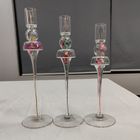 Glass candle holder with flower inside