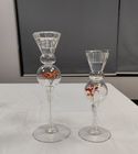 Glass candle holder with flower inside