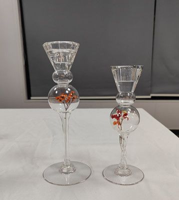 Glass candle holder with flower inside