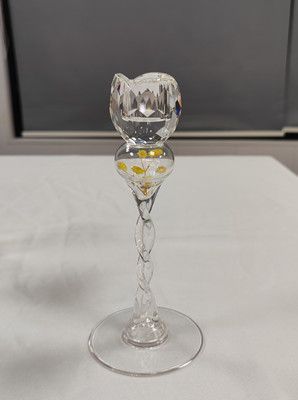 Glass candle holder with flower inside