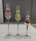 Glass candle holder with flower inside