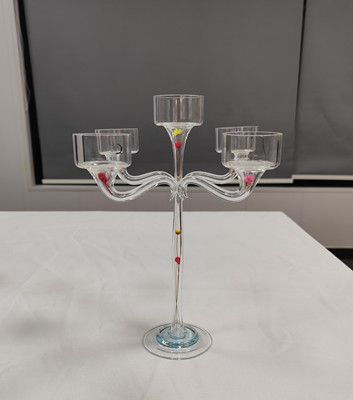 Glass candle holder with flower inside