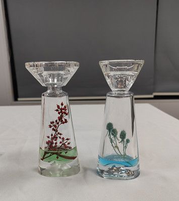 Glass candle holder with flower inside