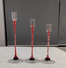 Glass candle holder with color decoration