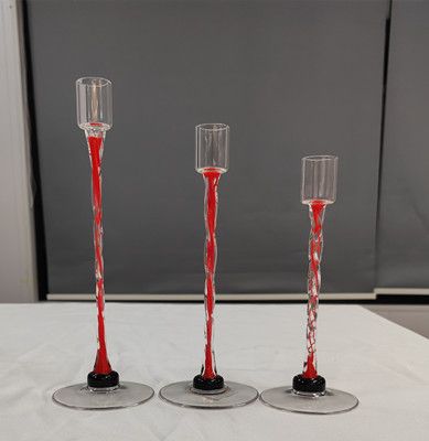 Glass candle holder with color decoration