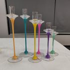 Glass candle holder with color decoration