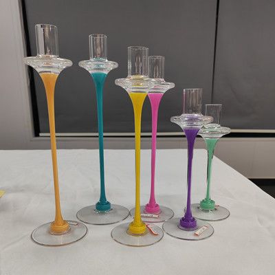 Glass candle holder with color decoration