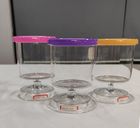 Glass candle holder with color decoration