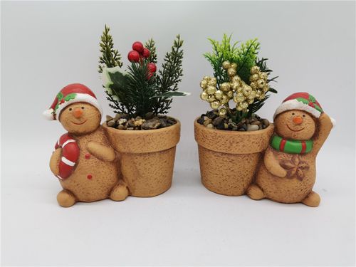 Ceramic gingerbread man pot with artificial plant