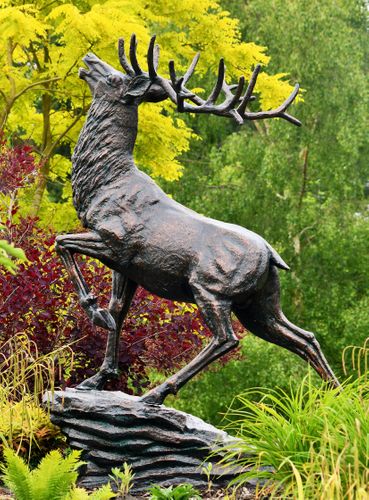 red deer on rock statue