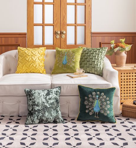 Set of  cushions with combination of handcrafted emboss, embeoridery, and iced details.