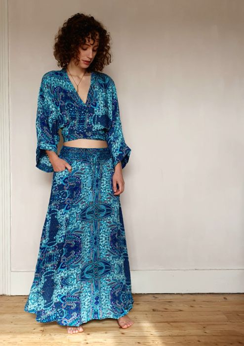 long pocket skirt with blouse with ties.