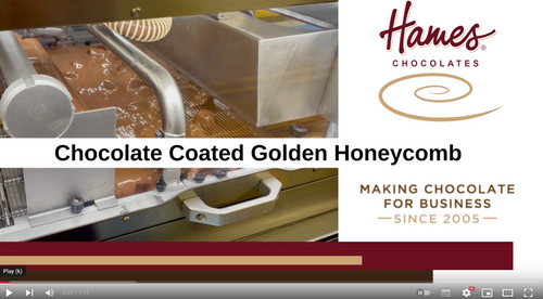 Watch the chocolate experts smother golden honeycomb pieces with smooth, creamy chocolate.