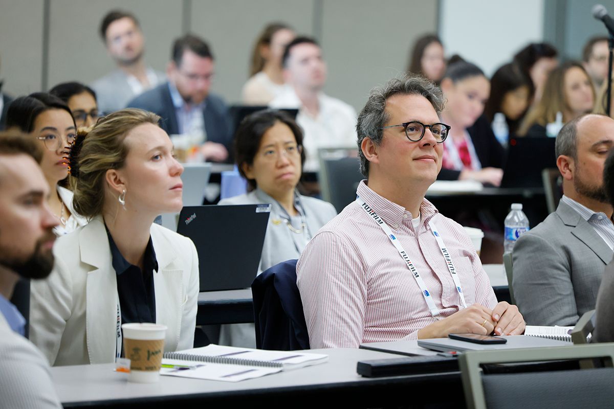 man in an education session looking interested