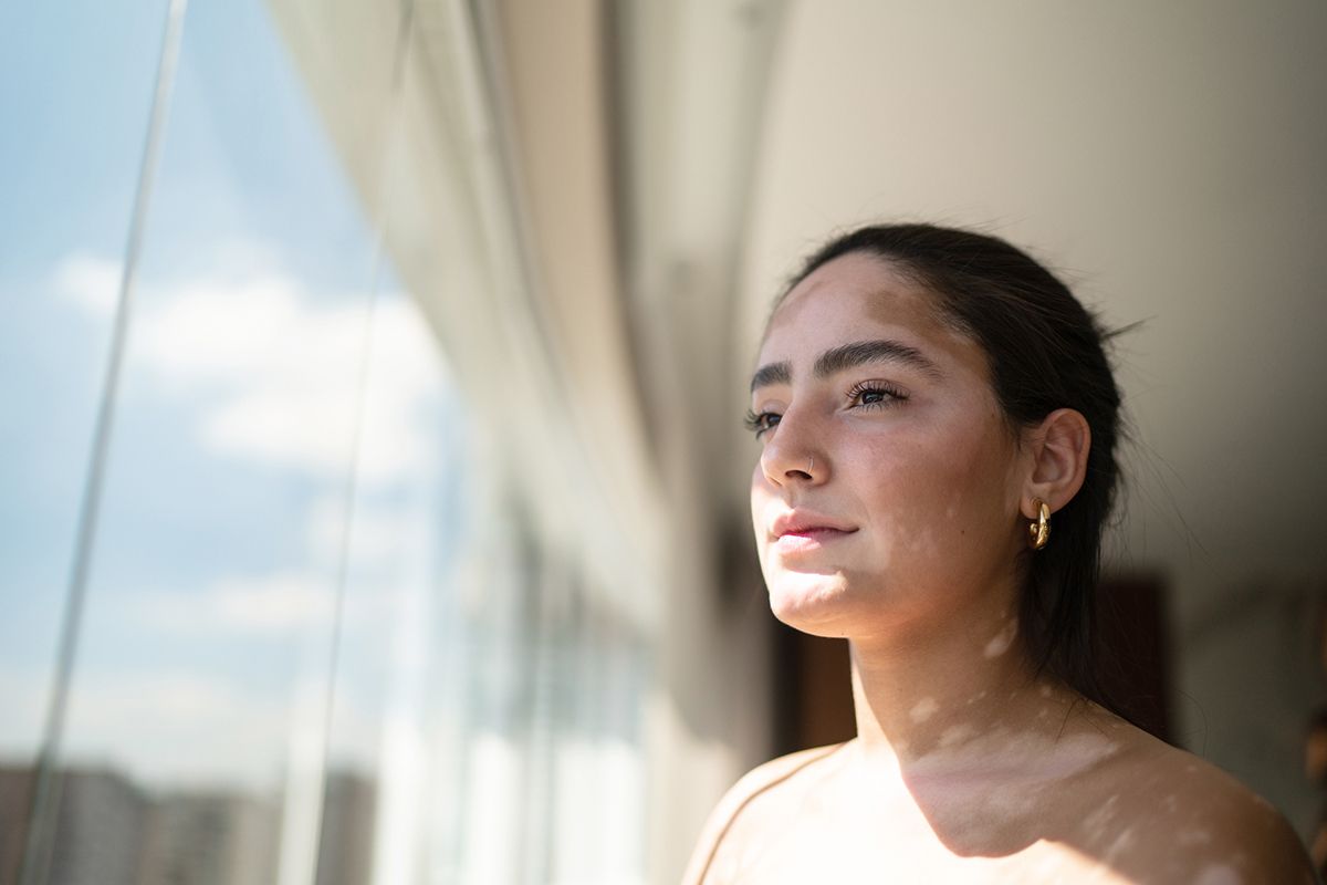 woman looking out window