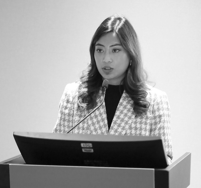 woman speaking at podium