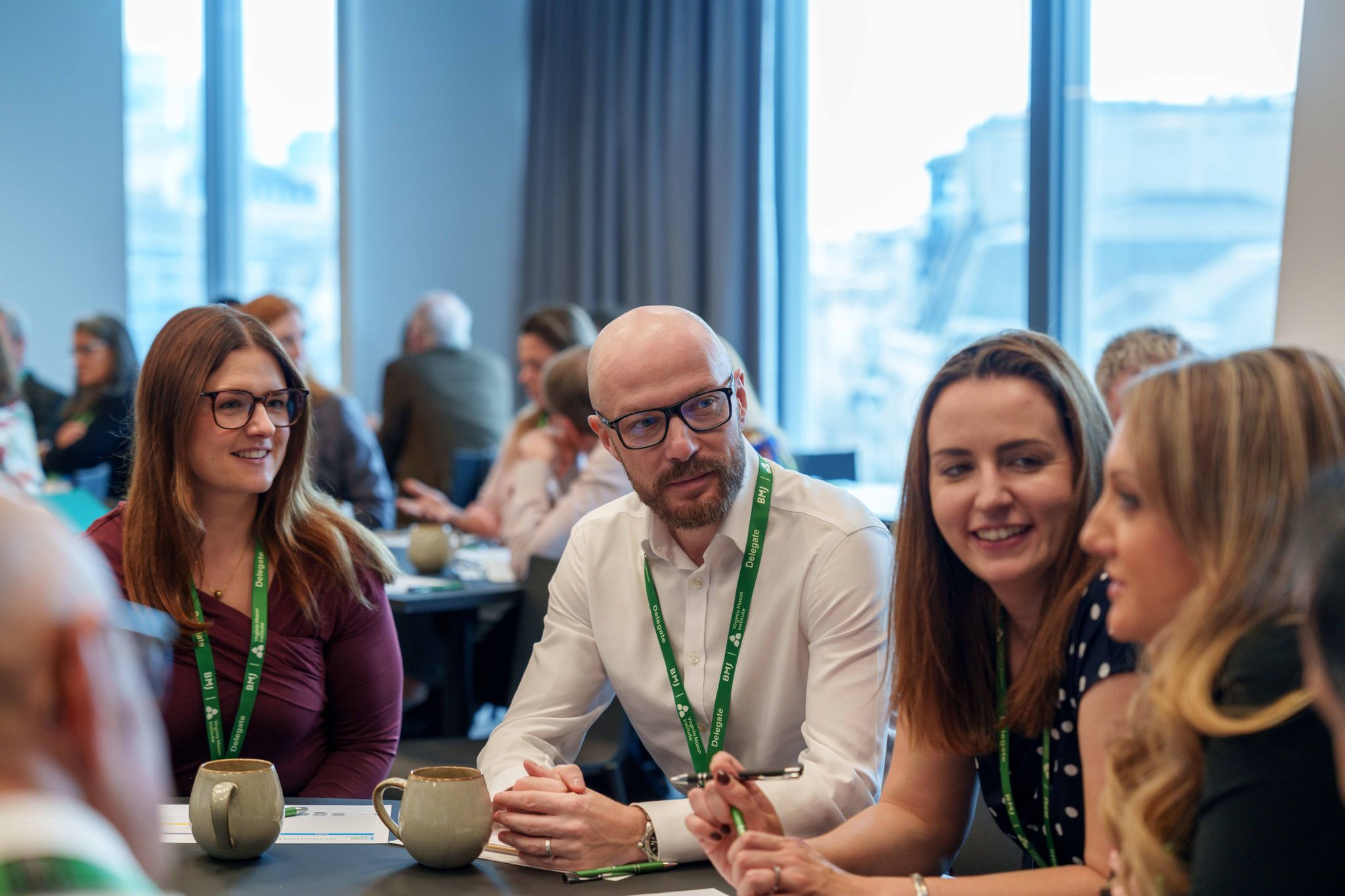 People at conference sitting around a table