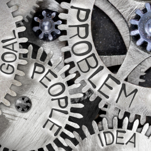 Cogs with Problems written on them