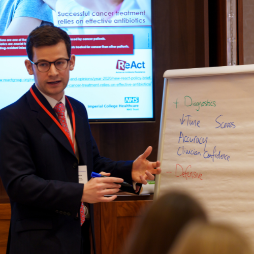Speaker at a conference with a flip chart