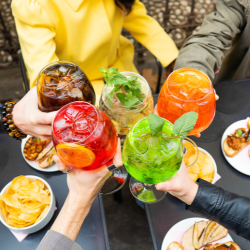 A group of people holding mocktails together