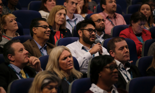 Person at a conference asking a question