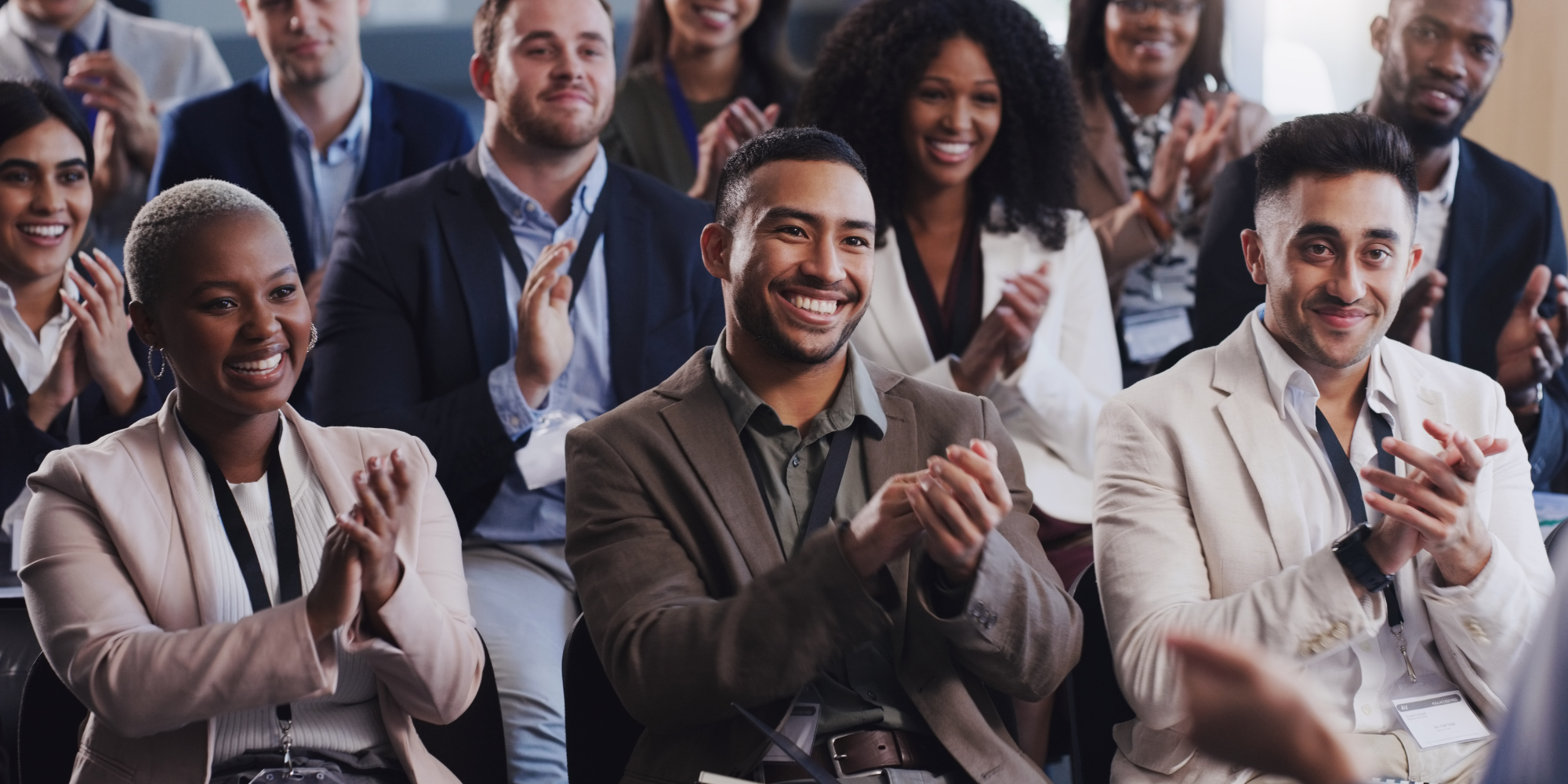 Conference room with people clapping