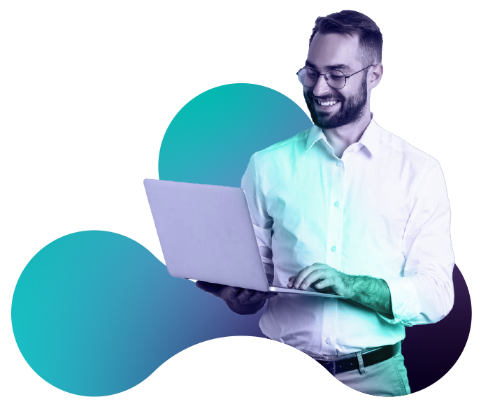 Smiling man in glasses using a laptop with abstract colorful shapes in the background.