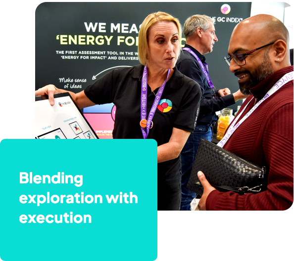 A woman pointing to graphs and explaining them to a man