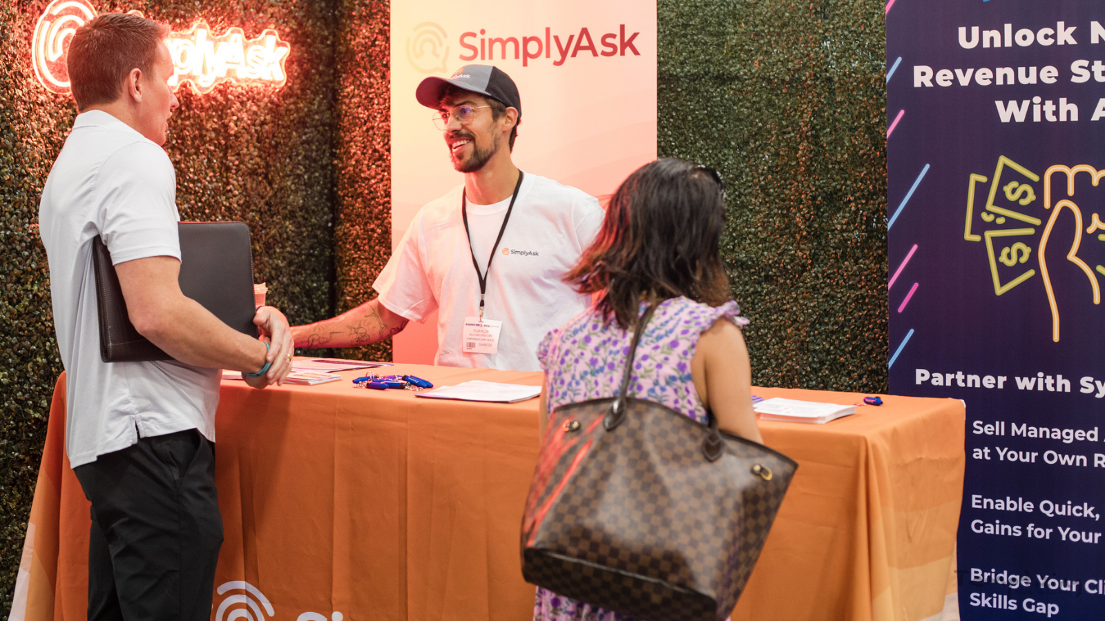 Exhibitors showcasing marketing solutions and speaking with attendees at B2B Marketing Expo US 2026 in Miami