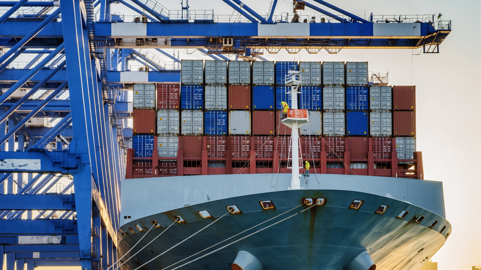 A picture of a large ship full on shipping containers