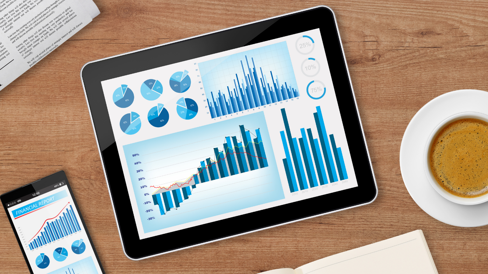 Tablet displaying financial charts and growth graphs on a desk, symbolizing tax research and 2026 tax planning analysis.
