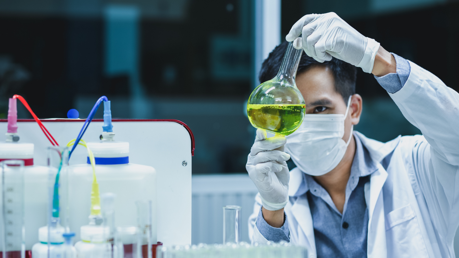 Biotech researcher analyzing chemical sample in a laboratory, representing innovation and investment opportunities in the US biotechnology industry