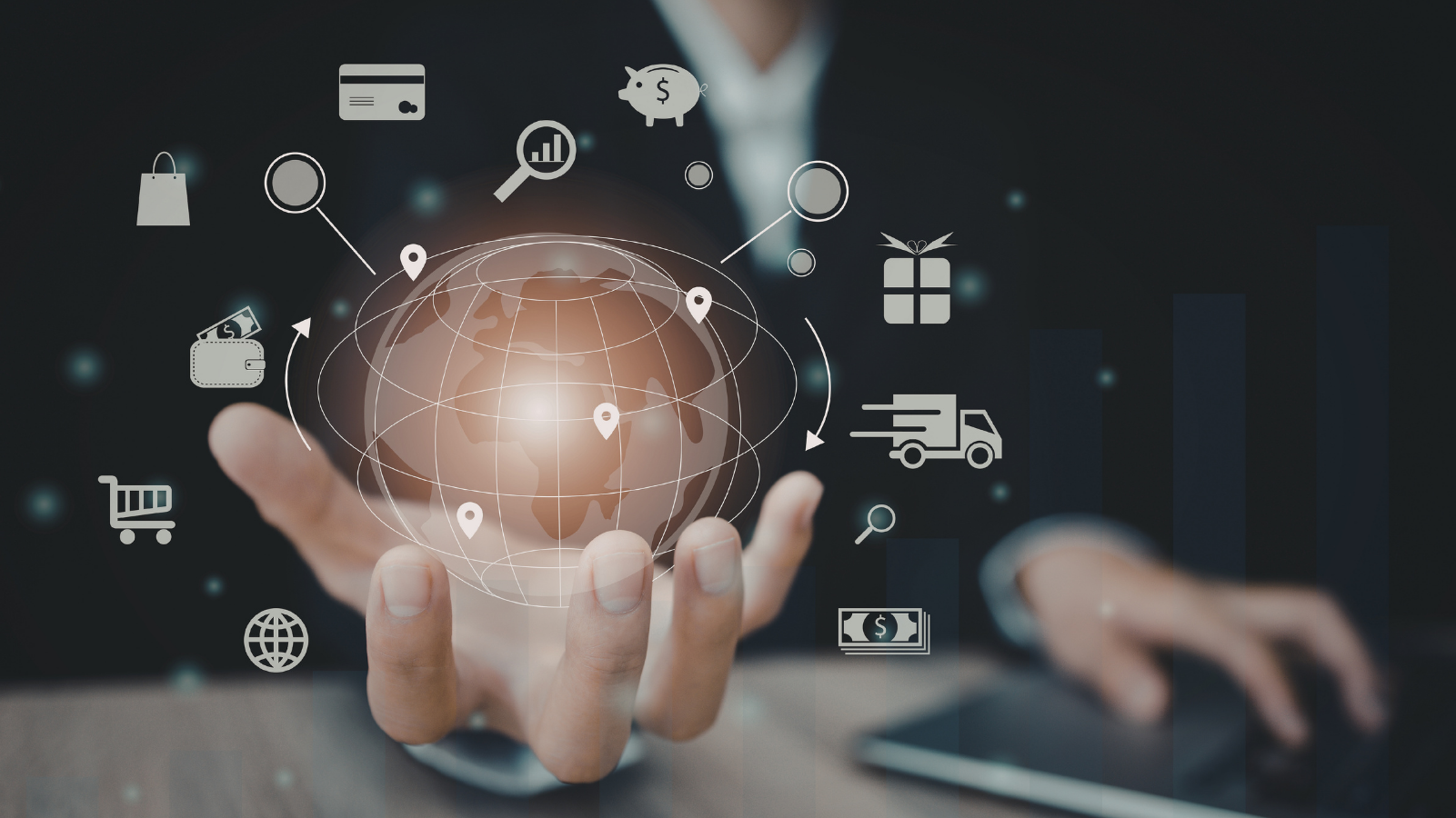 Businessperson holding a digital globe with icons representing global trade, finance, logistics and scalable business growth.