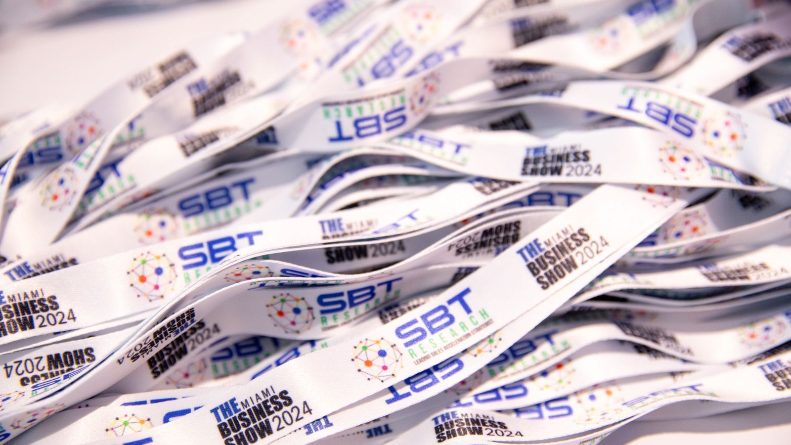 bundle of lanyards with the logo for The Business Show Miami, and SBT.