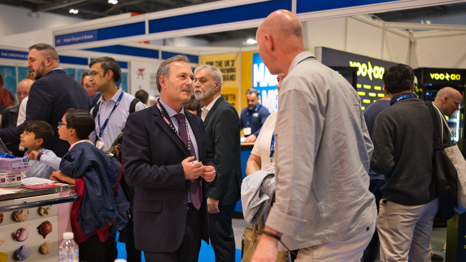An image of 2 people networking at the International Franchise Show in Excel London