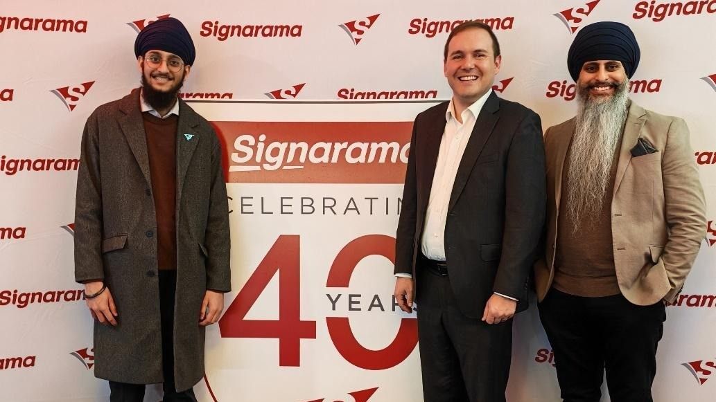 A picture of three signarama franchisees