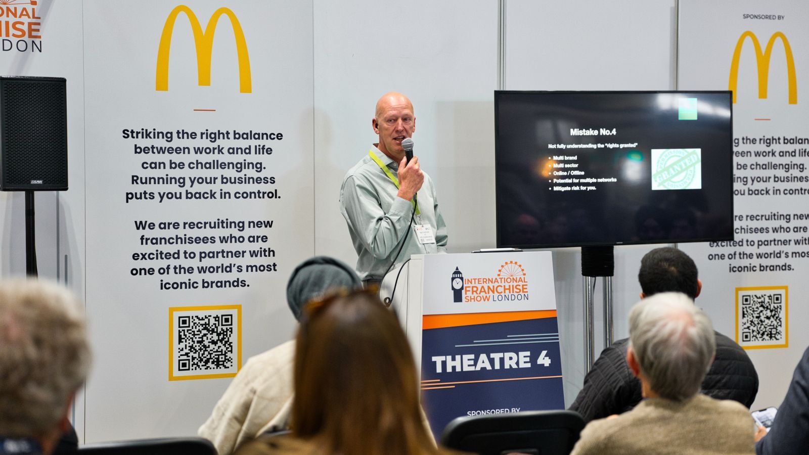 A picture of McDonald's speaking at the International Franchise Show