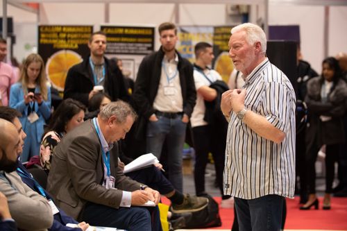 Male Speaker Engaging With Audience