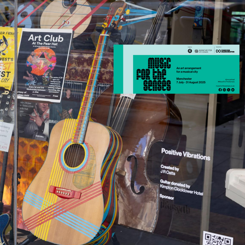 Artist J R Oatts painted guitar features in Manchester art trail