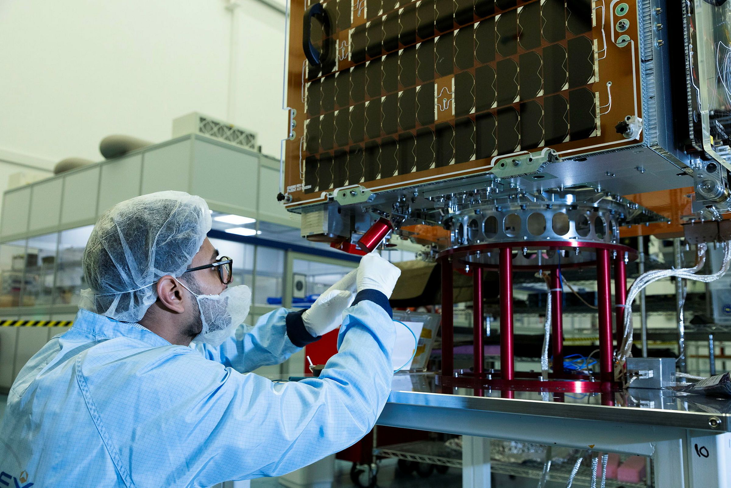 A member of staff from SSTL working on the Tyche satellite prior to its launch under the Istari programme. (Crown Copyright 2025) 